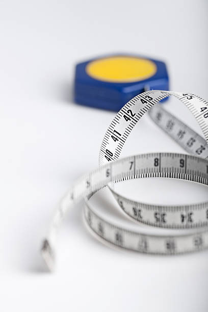 istock tape measure rolled on white background 120723226