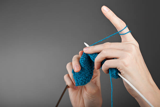 istock Hands of a young woman knitting 120723307