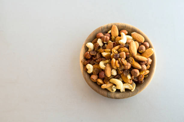 istock wooden bowl with mix nuts 1207233137