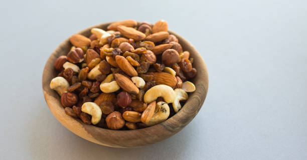 istock wooden bowl with mix nuts 1207233203
