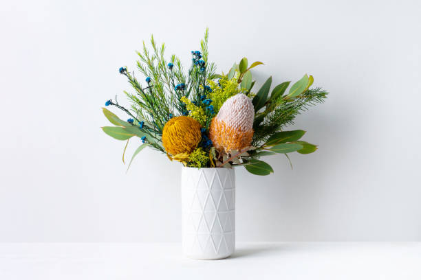 Beautiful mostly Australian native flowers in a white vase.