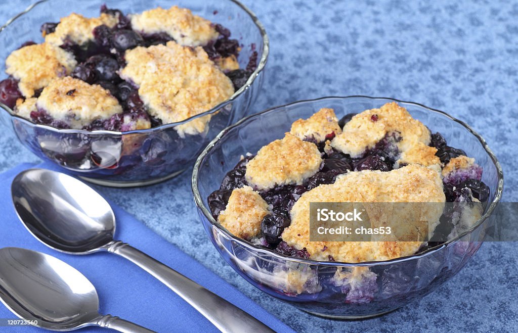 Blueberry Cobbler Dessert Two glass bowls of blueberry cobbler dessert Cobbler - Dessert Stock Photo