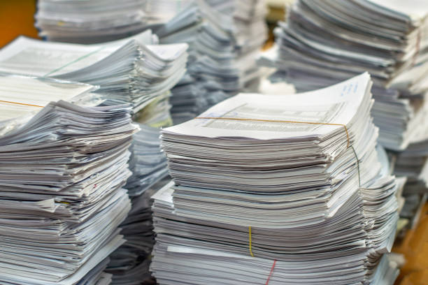 istock pile of paper documents in the office 1207237341