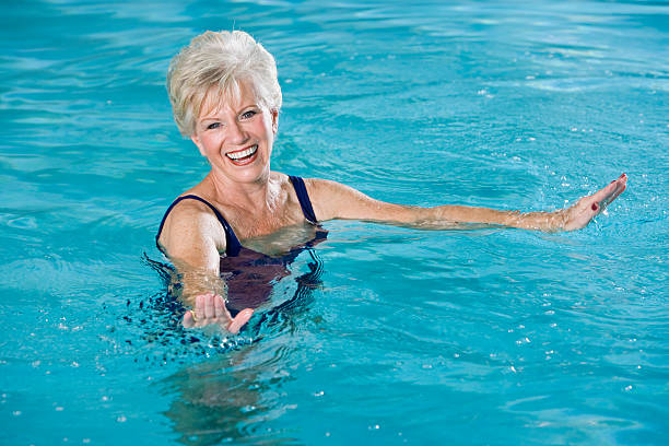 istock Active senior woman in swimming pool 120724023