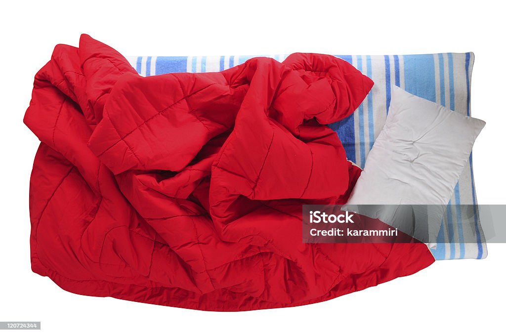 Messy bed. Top view of an unattended bed over white background. Blanket Stock Photo