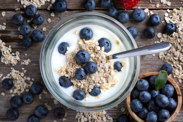 istock Strawberries, blueberries, oat flakes and yoghurt 1207245042
