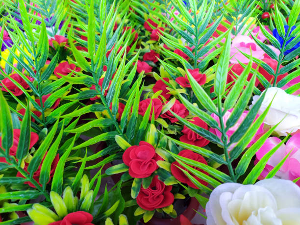 istock Beautiful multicolored artificial flowers background 1207246957