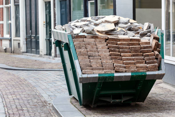 Neat industrial skip full loaded with bricks and rubble