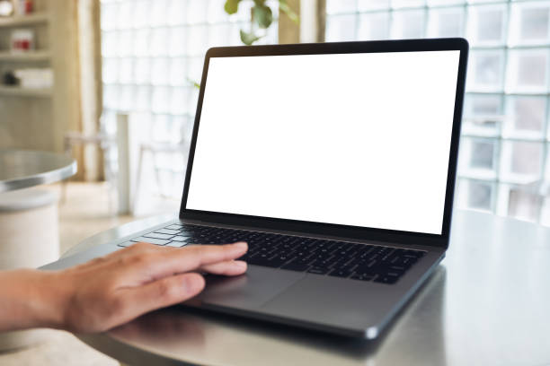 istock a woman using and touching on laptop computer touchpad with blank white desktop screen 1207247336