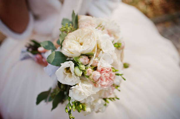 istock Wedding bouquet at hand of charming bride. 1207248558