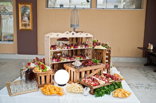 Dessert table of delicious snacks on wedding reception.