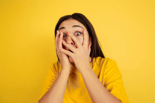 istock Caucasian woman's portrait isolated on yellow studio background 1207248731