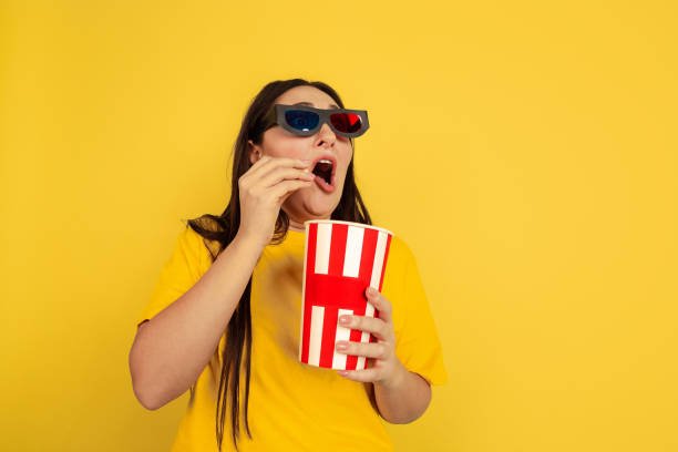 istock Caucasian woman's portrait isolated on yellow studio background 1207248772