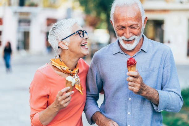istock Happy senior couple eating ice cream 1207250013