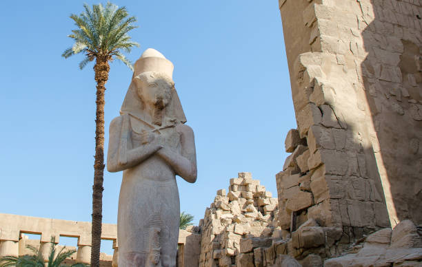 Statue of Ramses II with his daughter Merit-Amon at the Karnak Temple in Luxor Statue of Ramses II with his daughter Merit-Amon at the Karnak Temple in Luxor. Egypt amon photos stock pictures, royalty-free photos & images