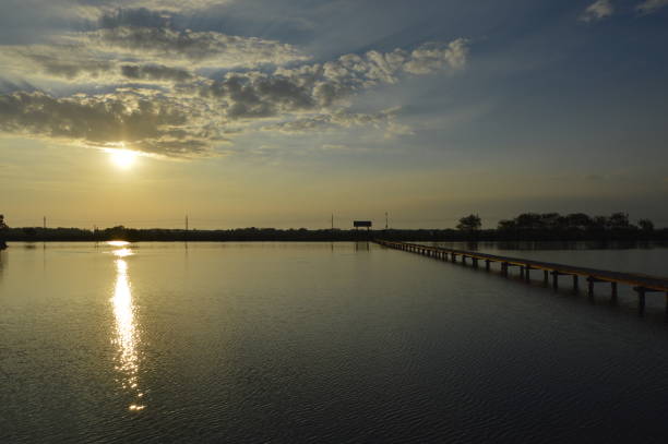 Wooden Bridge at Calm and Beautiful Place at Sunset stock photo