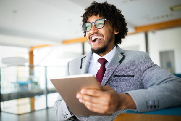 istock Portrait of man in office using tablet 1207253338
