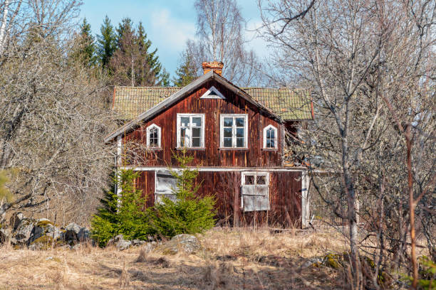 Abandoned and overgrown house on the Swedish countryside stock photo