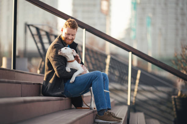 istock Handsome young man spending time with his dog 1207256209