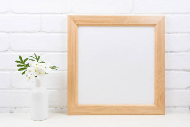 istock Wooden square frame mockup with Tobacco flowers 1207257572