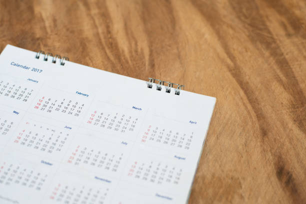 istock Calendar page on wood background in planning concept. 1207257702
