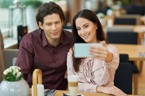 istock Young Couple taking selfie In Cafe 1207258034