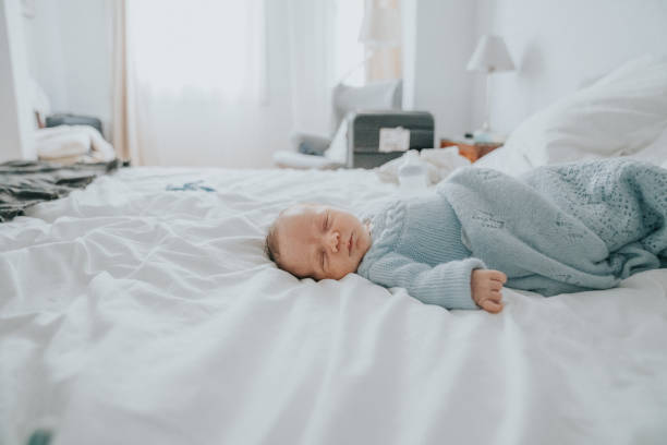 istock Baby boy on bed 1207259360