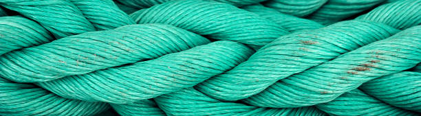istock Nautical background. Old blue frayed ship rope closeup, border design panoramic banner 1207259526