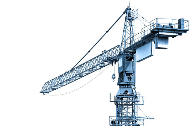 Blue toned construction crane working Construction crane working on isolated white background tower crane stock pictures, royalty-free photos & images