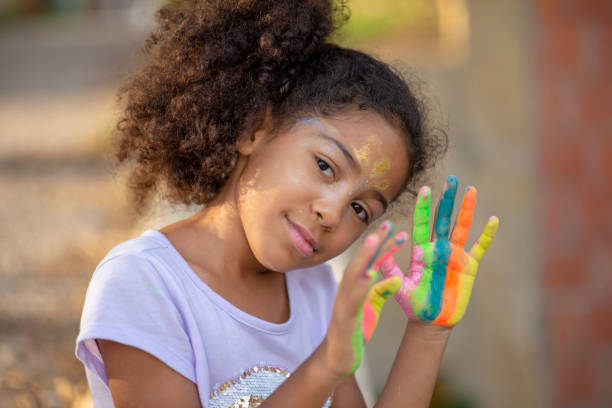 istock beautiful happy girl with painted hands 1207261635