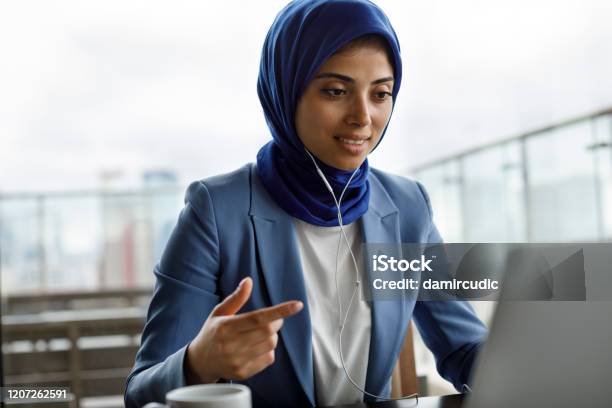 Young Woman With Headphones Working On Laptop Stock Photo - Download Image Now - Education Training Class, Women, Internet
