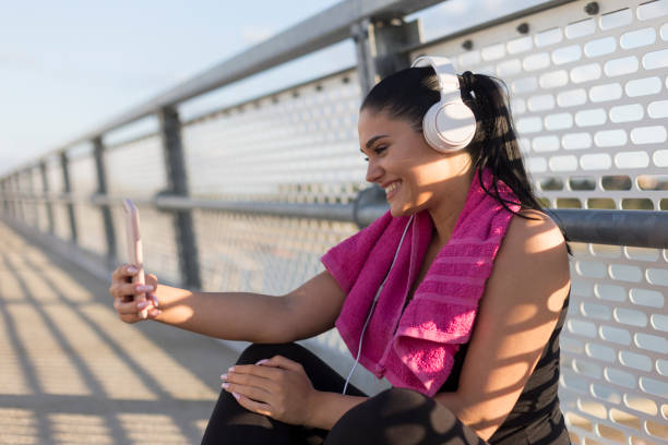 istock Smiling athlete taking selfie after outdoor run 1207264615