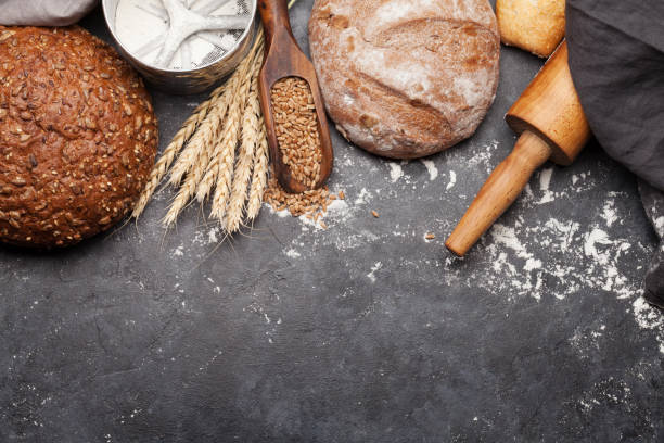 istock Various bread with wheat, flour and cooking utensils 1207264741