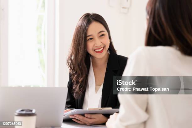 A Young Attractive Asian Woman Is Interviewing For A Job Her Interviewers Are Diverse Human Resources Manager Conducting Job Interview With Applicants In Office Stock Photo - Download Image Now