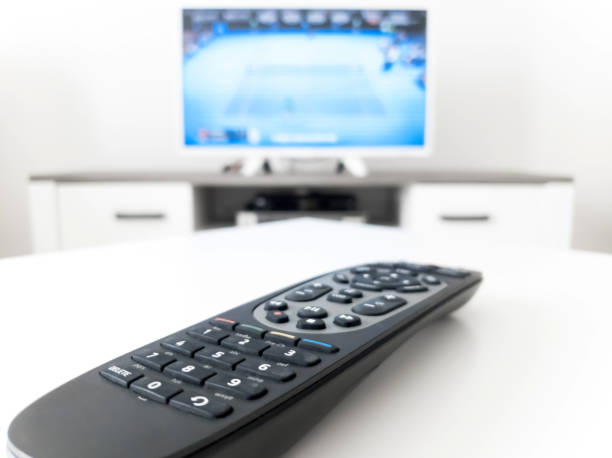 istock TV with white screen on a stand in the room. 1207265112
