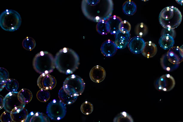 istock Blurred of Bubble on black background, Bokeh with background. 1207265723