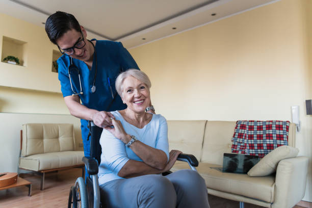 istock Young Caregiver is Helping a Disabled Person 1207266316