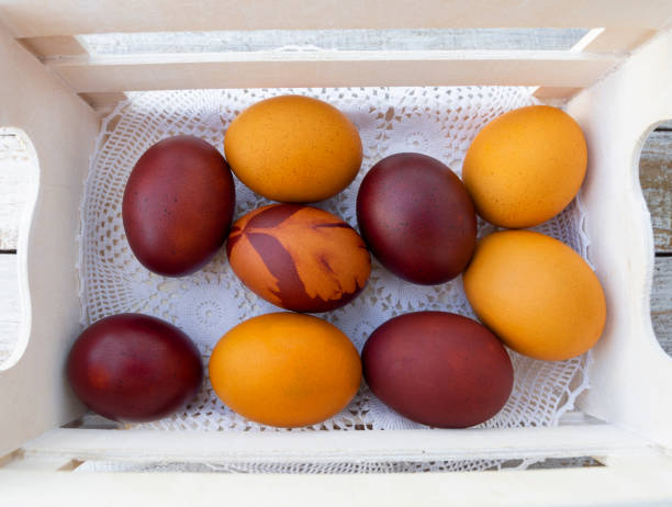 istock Painted Easter eggs lie in a basket on a handmade knitted napkin 1207266343