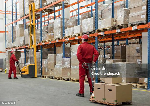 Workers In Storehouse Stock Photo - Download Image Now - Forklift, Freight Transportation, Wrapped