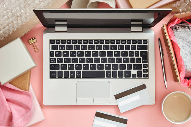 istock Online shopping concept on pink desk 1207270995
