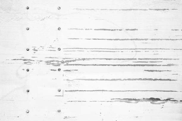 istock Texture of white scratched metal wall with rivets 1207271036