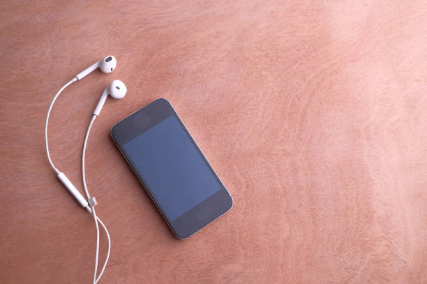 istock top view of smart phone and headphone on table 1207271885