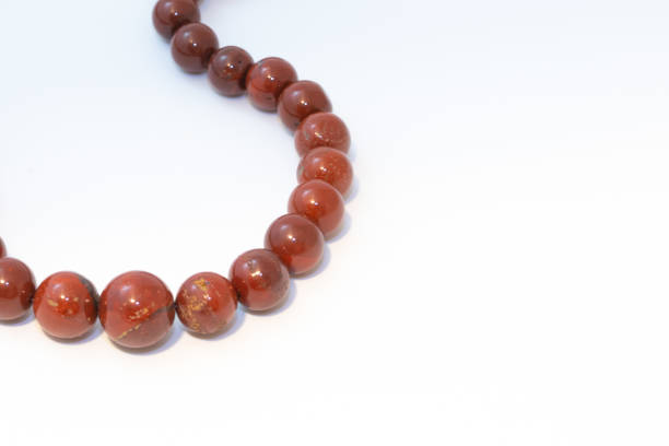 istock Brown jasper beads isolated on white background 1207271986