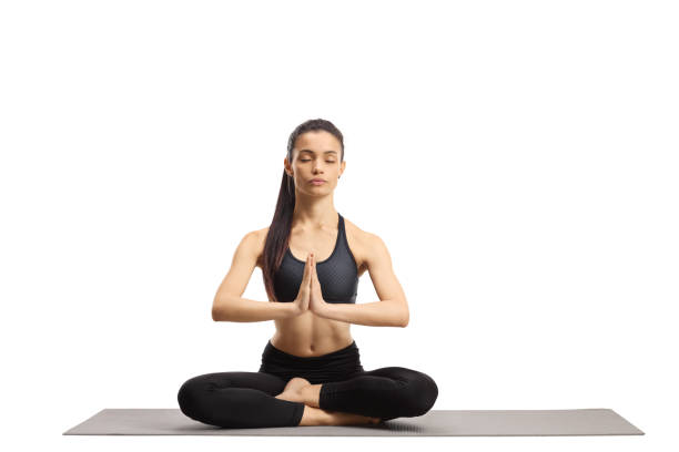 istock Young female practicing meditation with closed eyes 1207272939