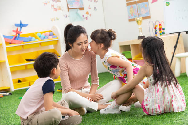istock Kindergarten teachers and the children 1207273413