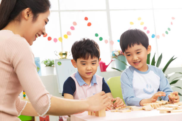 istock Kindergarten teachers and the children 1207273475