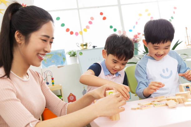 istock Kindergarten teachers and the children 1207273610