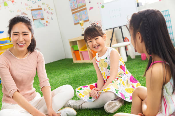 istock Kindergarten teachers and the children 1207274834