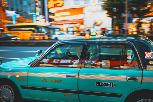 Tokyo, Japan - November 3, 2025 : Ride-hailing company Go App advertisement on a taxi in Tokyo, Japan.