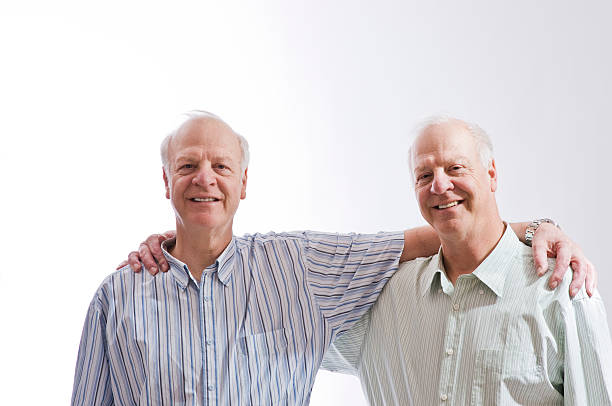 Happy Older Identical Twins stock photo